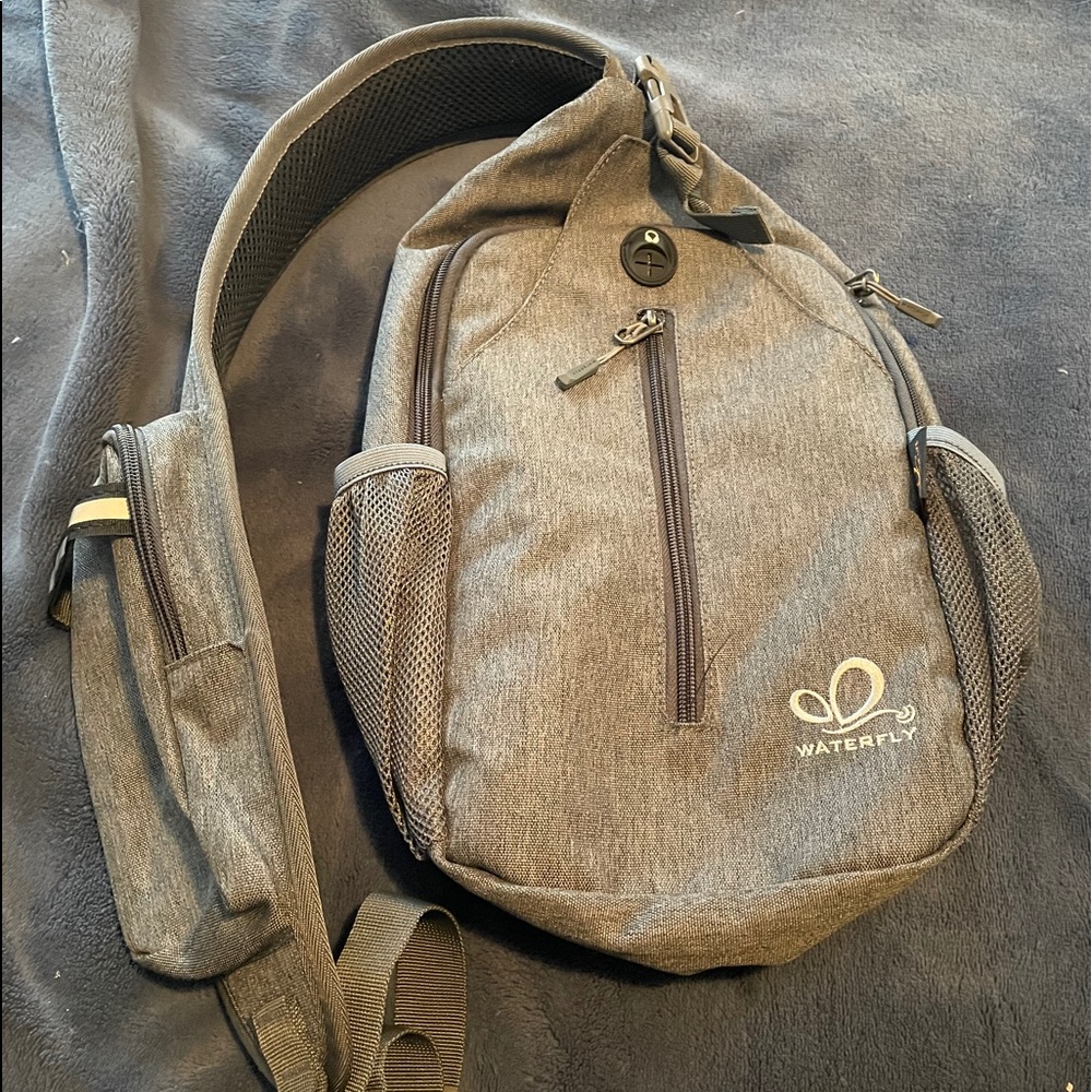 Sling bag, will fit phone and tablet.